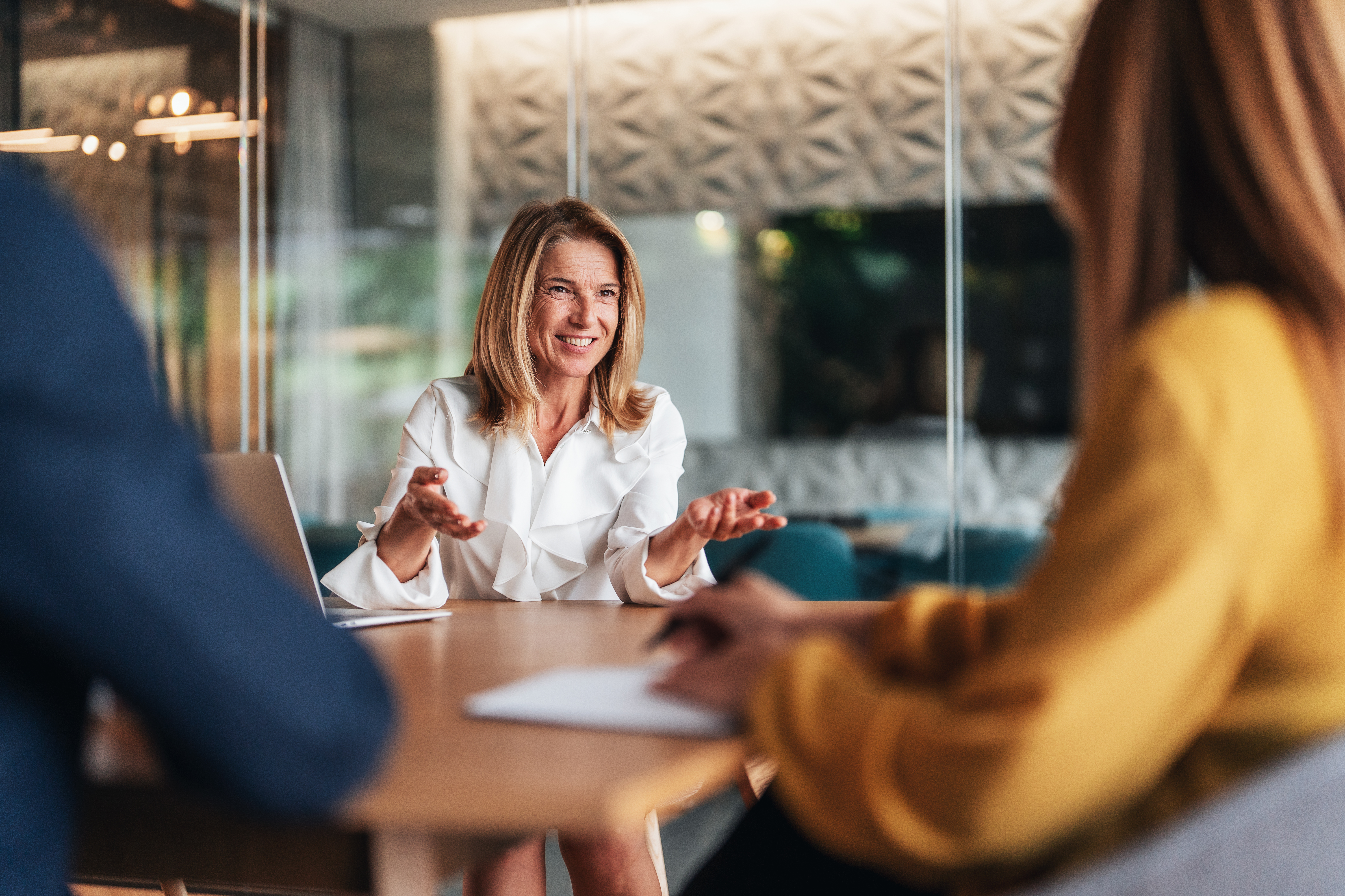 Adviser reviewing a prepared client brief before a meeting.